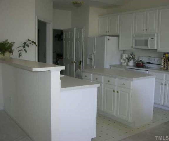10470 Dapping Drive Raleigh, NC 27614 - Photo 2 of 8 a kitchen with sink cabinets and refrigerator