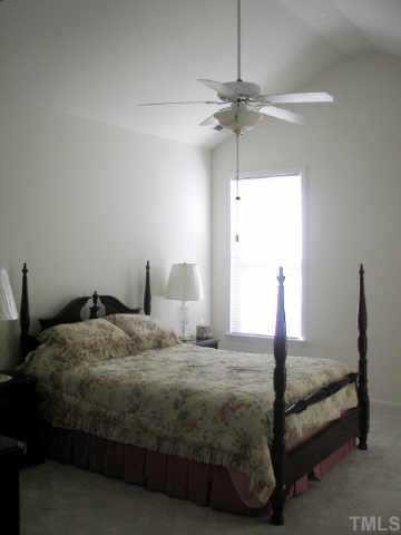 10470 Dapping Drive Raleigh, NC 27614 - Photo 5 of 8 a bedroom with a bed and ceiling fan