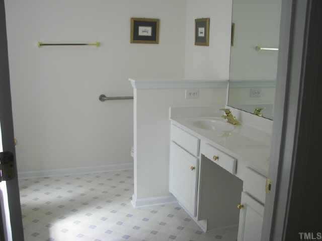 10470 Dapping Drive Raleigh, NC 27614 - Photo 6 of 8 a bathroom with a sink and vanity