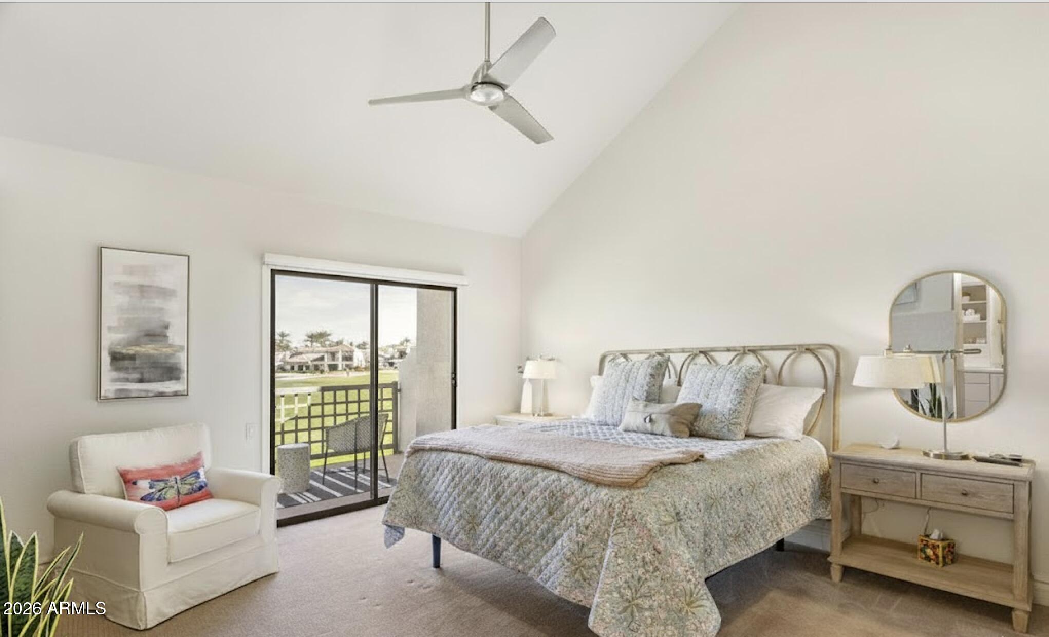 7272 East Gainey Ranch Road, Unit 12 Scottsdale, AZ 85258 - Photo 11 of 28 a bedroom with a bed and a couch