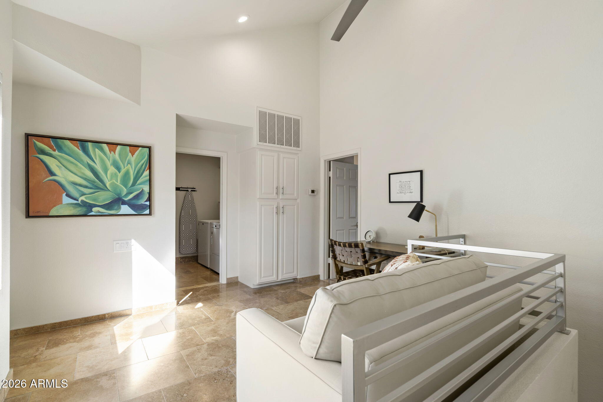 7272 East Gainey Ranch Road, Unit 12 Scottsdale, AZ 85258 - Photo 15 of 28 a bedroom with a bed and a television