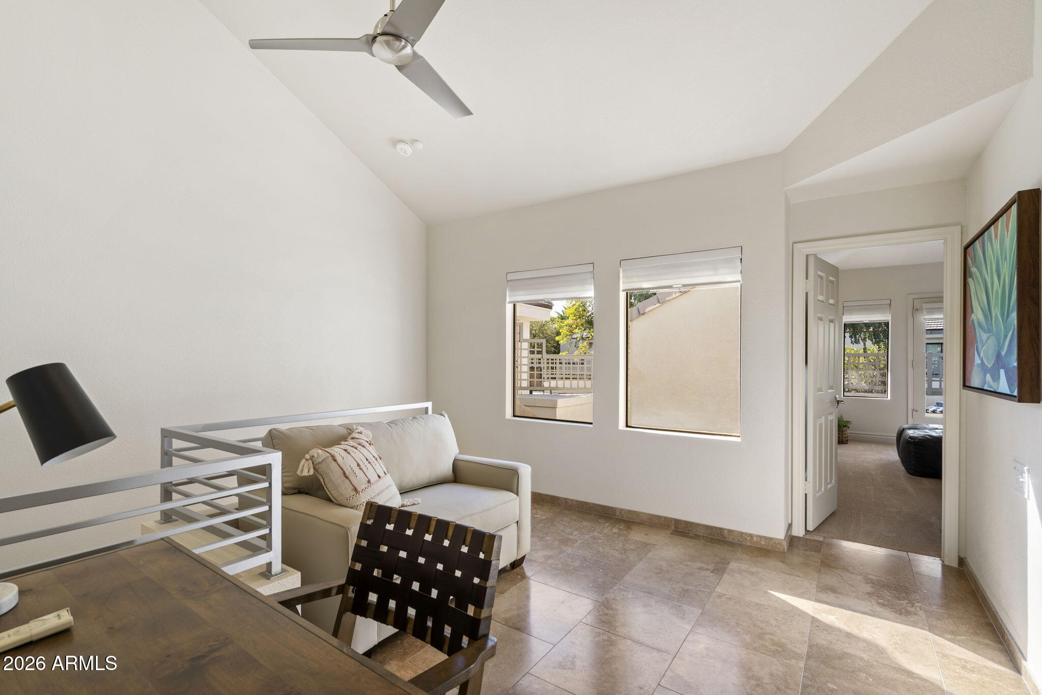 7272 East Gainey Ranch Road, Unit 12 Scottsdale, AZ 85258 - Photo 16 of 28 a living room with furniture and a window