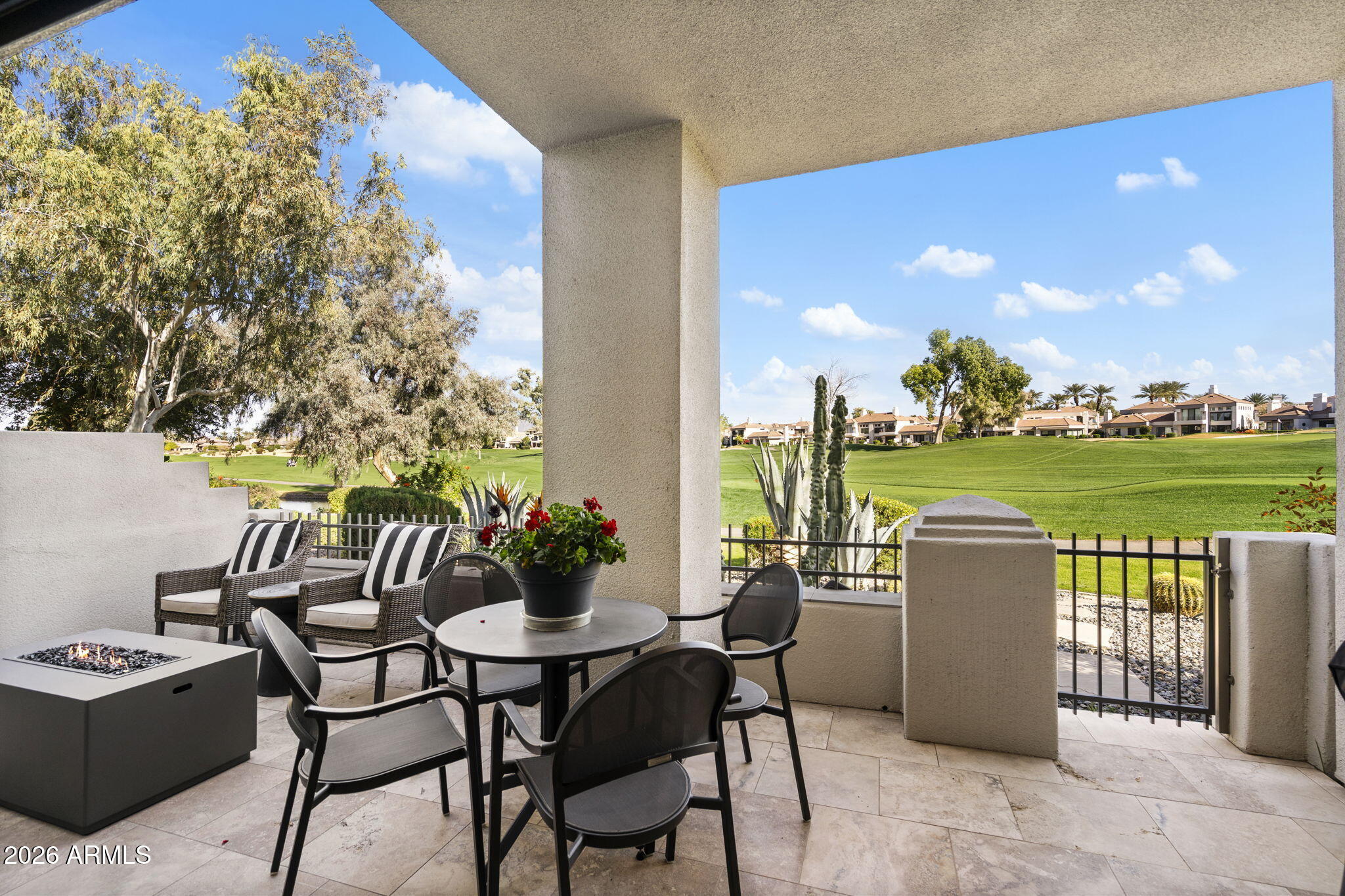 7272 East Gainey Ranch Road, Unit 12 Scottsdale, AZ 85258 - Photo 20 of 28 a dining room with furniture and garden view