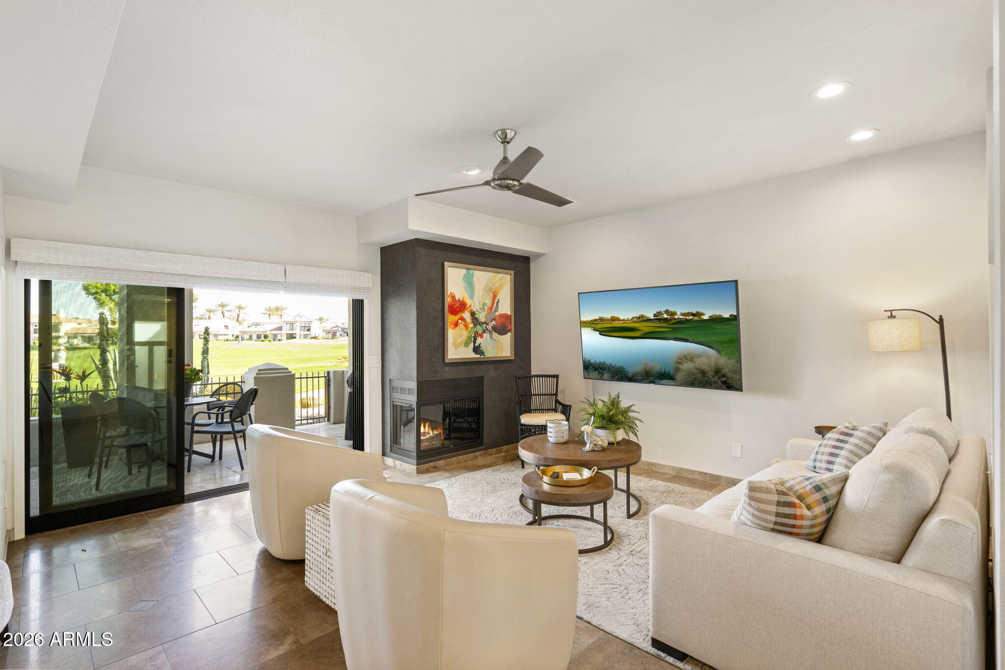 7272 East Gainey Ranch Road, Unit 12 Scottsdale, AZ 85258 - Photo 3 of 28 a living room with furniture and a flat screen tv