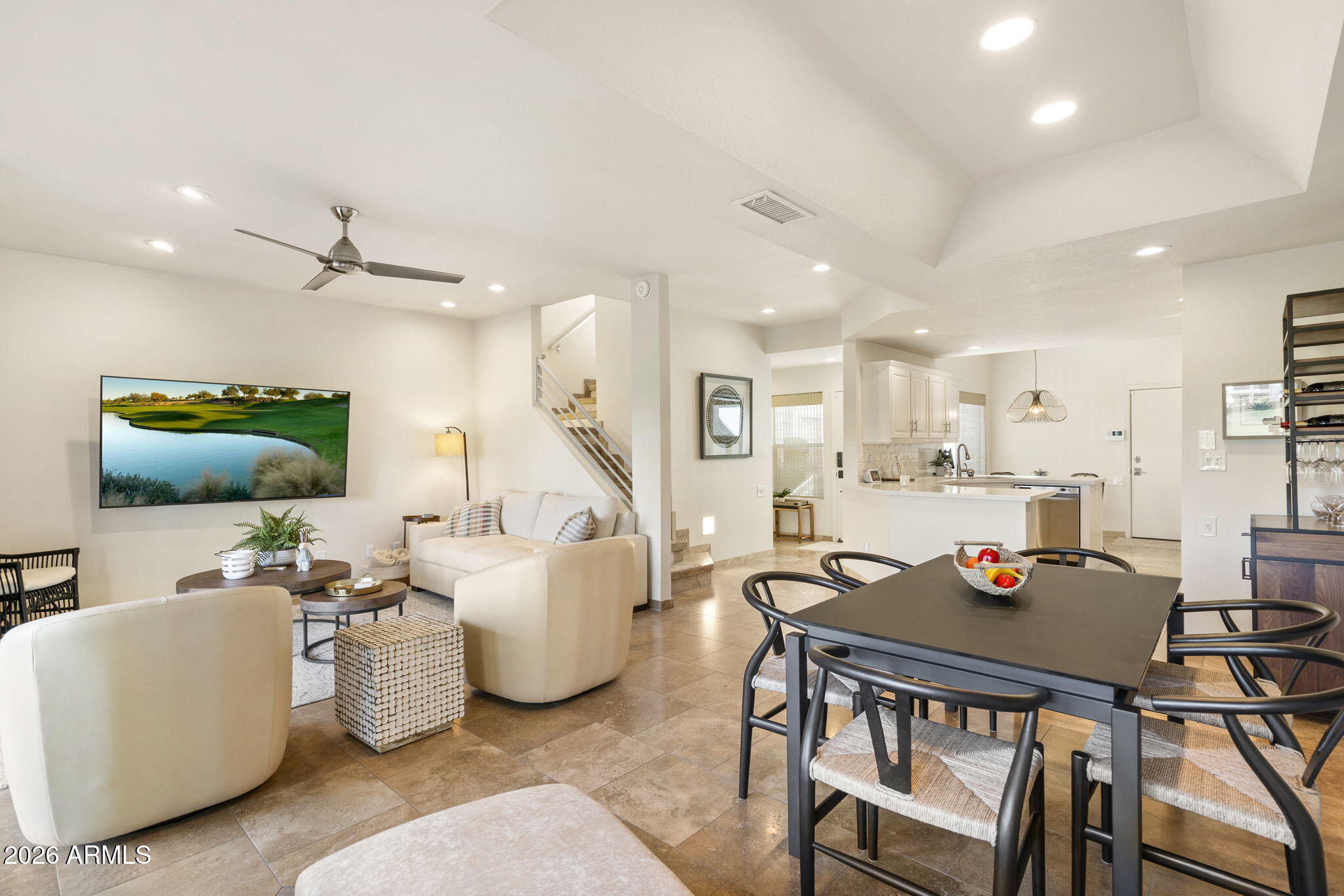 7272 East Gainey Ranch Road, Unit 12 Scottsdale, AZ 85258 - Photo 4 of 28 a living room with furniture kitchen view and a flat screen tv