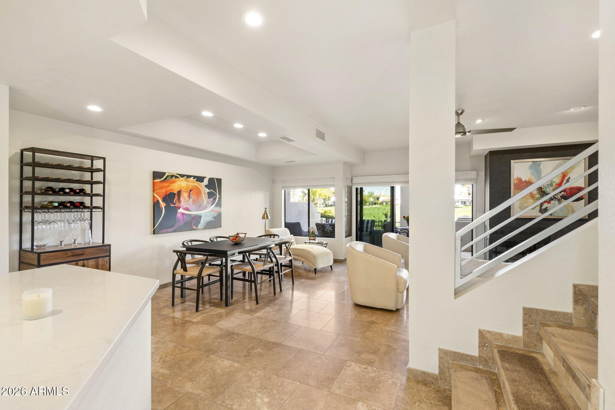7272 East Gainey Ranch Road, Unit 12 Scottsdale, AZ 85258 - Photo 10 of 28 a living room with furniture and a flat screen tv
