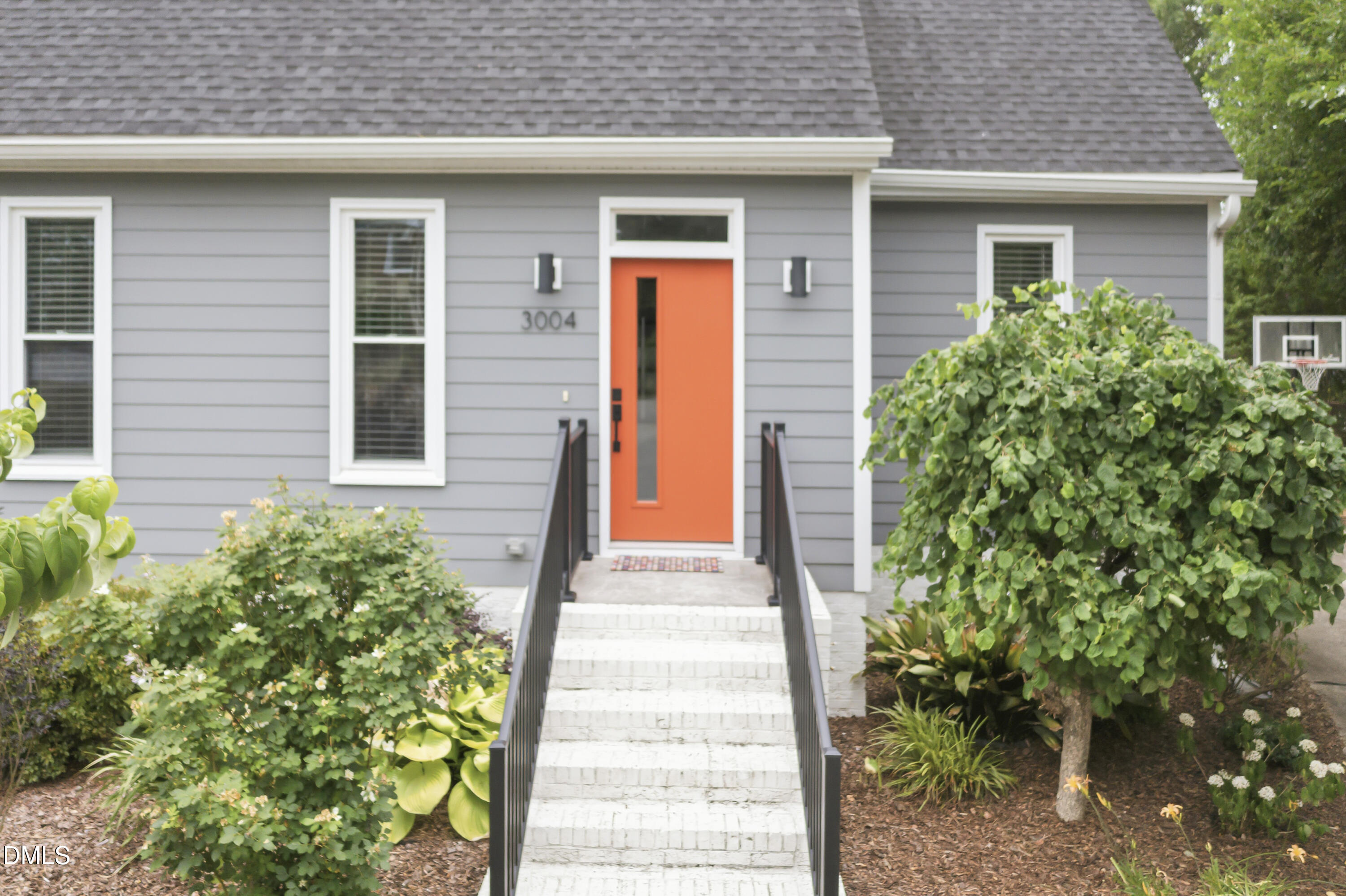3004 West Annaley Drive Raleigh, NC 27604 - Photo 5 of 44 a front view of a house with a garden