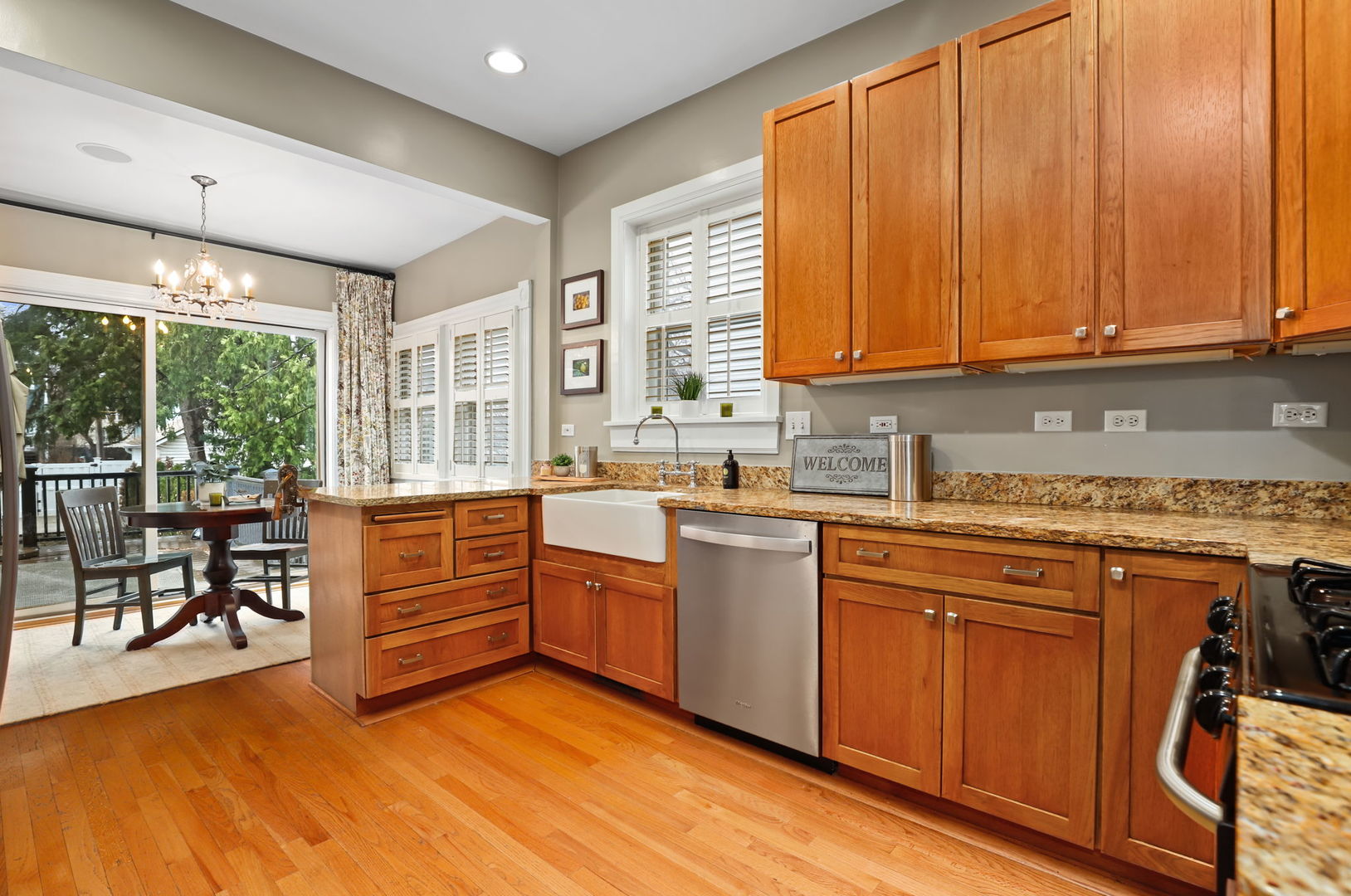 4232 North Tripp Avenue Chicago, IL 60641 - Photo 14 of 46 a kitchen with stainless steel appliances granite countertop wooden cabinets a sink and a stove