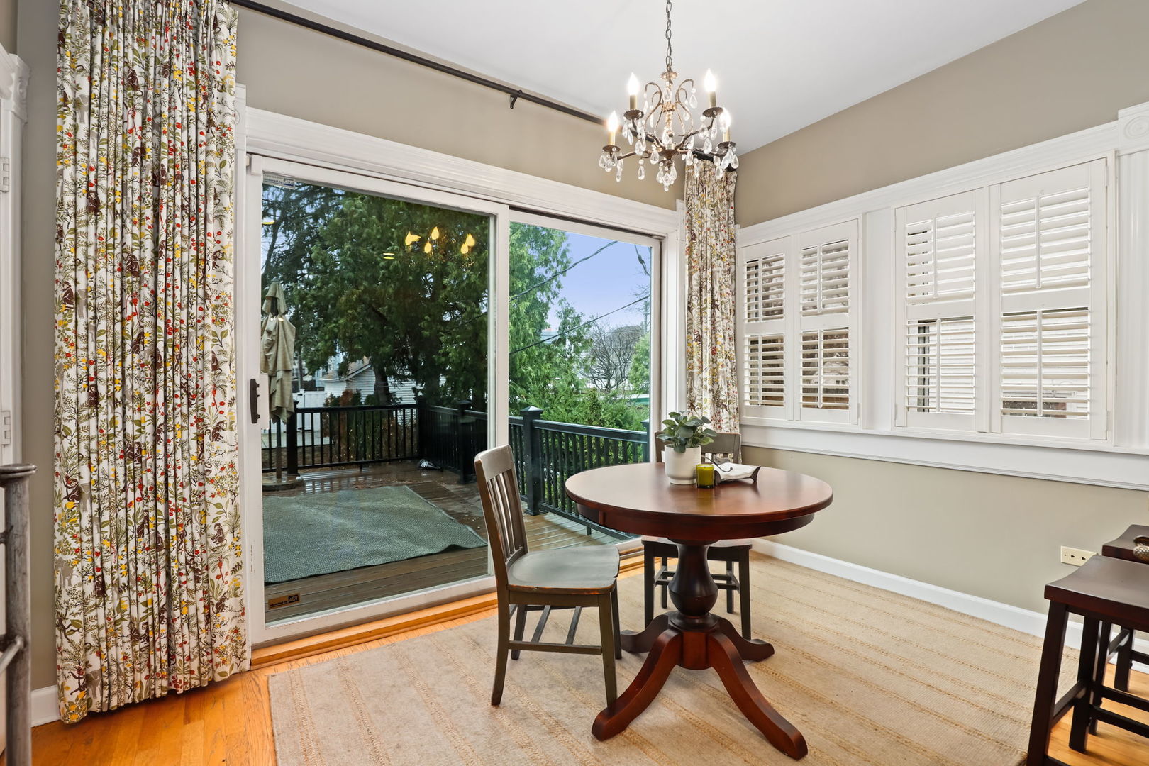 4232 North Tripp Avenue Chicago, IL 60641 - Photo 18 of 46 a dining room with furniture wooden floor a chandelier and a rug