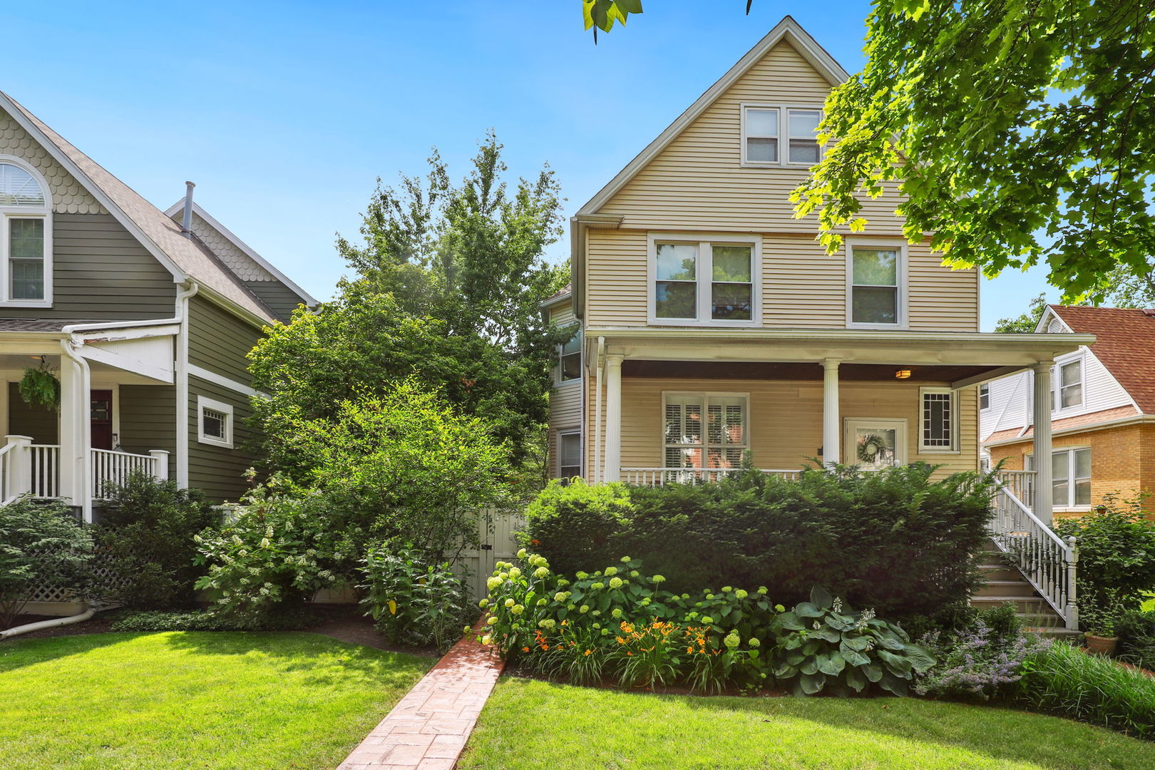 4232 North Tripp Avenue Chicago, IL 60641 - Photo 2 of 46 a front view of a house with a garden