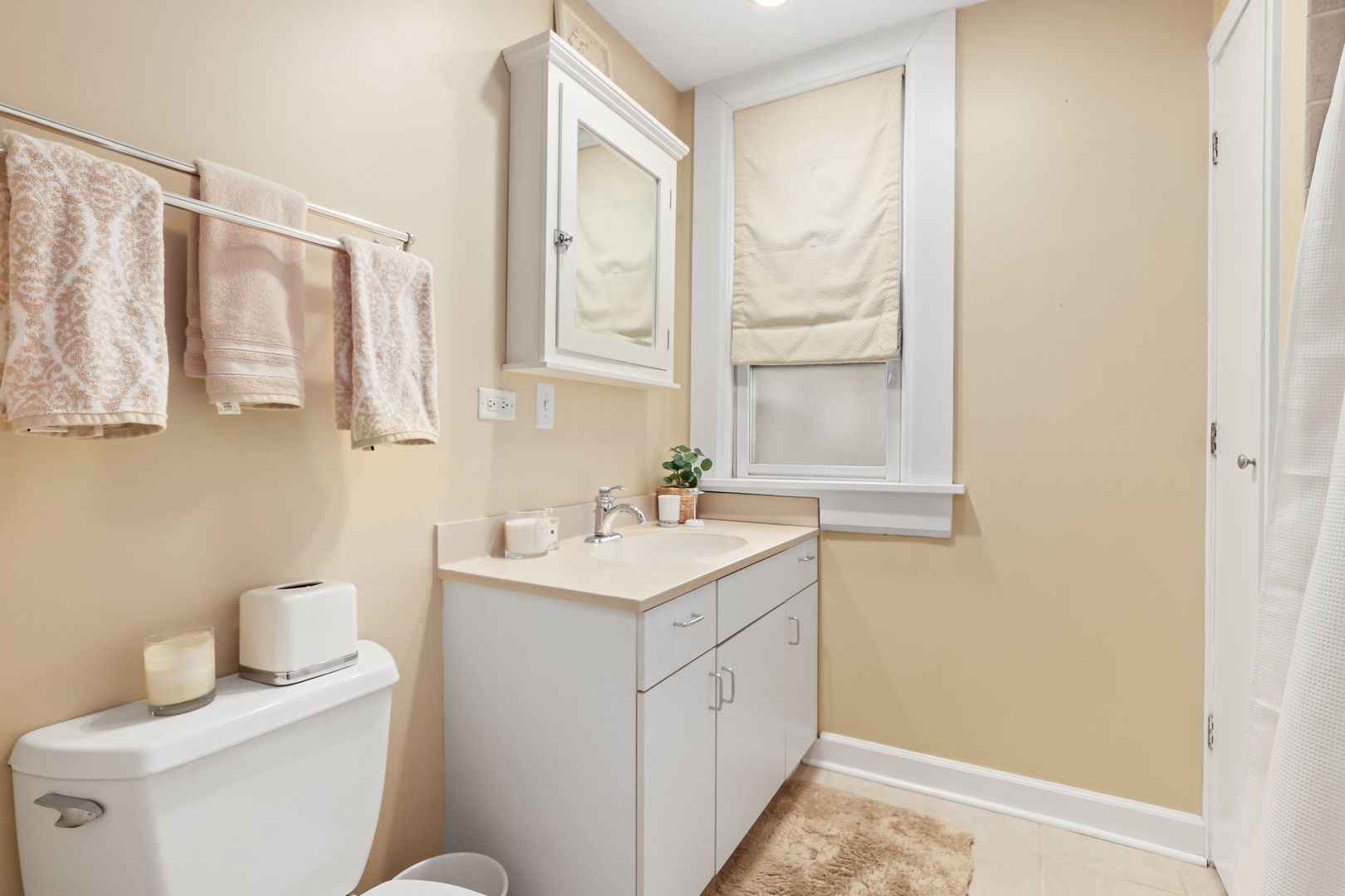 4232 North Tripp Avenue Chicago, IL 60641 - Photo 25 of 46 a bathroom with a sink a toilet and a mirror