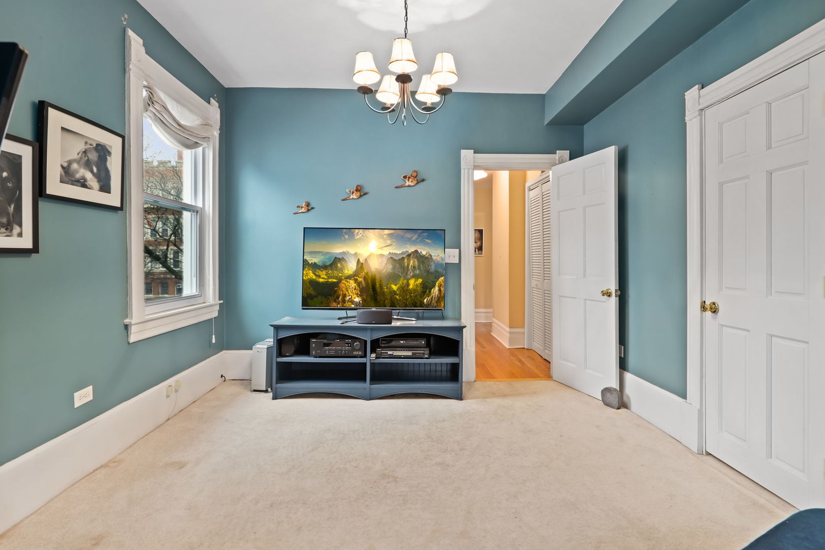 4232 North Tripp Avenue Chicago, IL 60641 - Photo 29 of 46 a living room with furniture and a chandelier