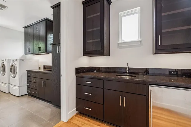 a kitchen with a sink and cabinets