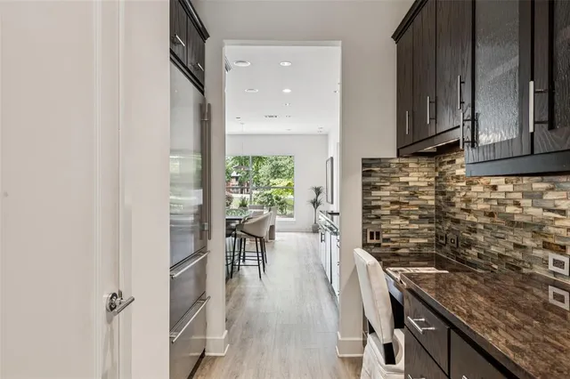 a kitchen with a sink and wooden cabinets