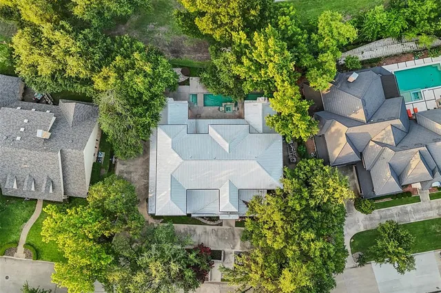 an aerial view of a house with a garden