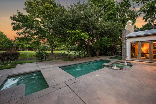 a view of a park with large trees