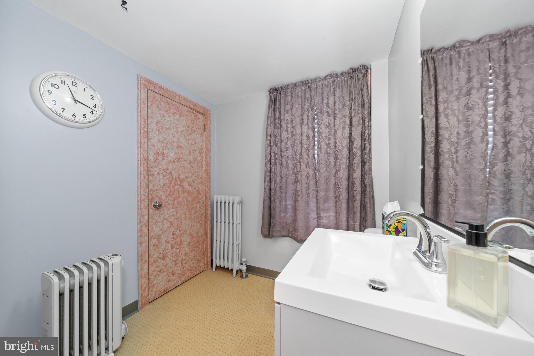 3934 Thompsons Bridge Road Wilmington, DE 19807 - Photo 13 of 28 a bathroom with a sink and a mirror