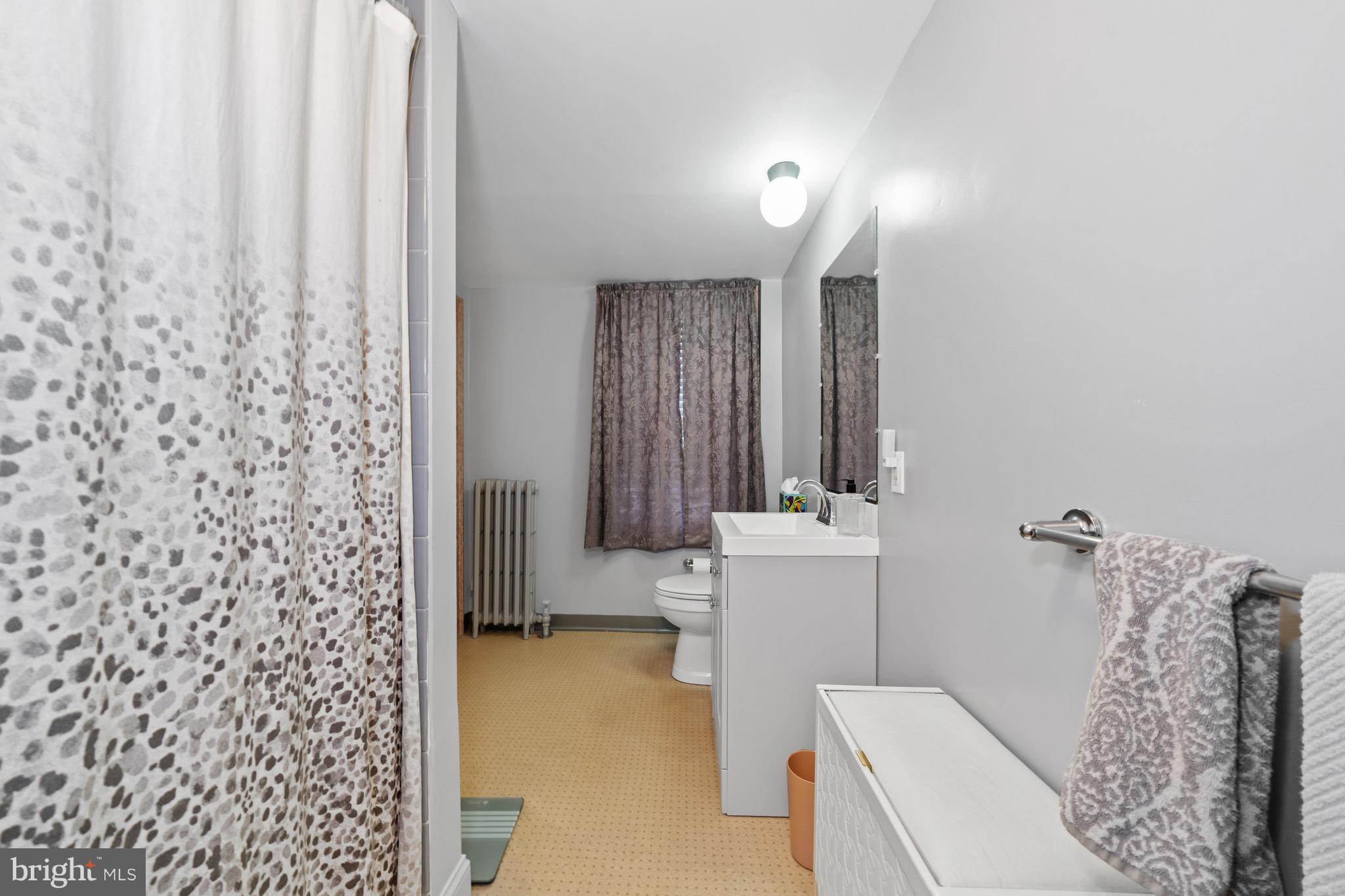 3934 Thompsons Bridge Road Wilmington, DE 19807 - Photo 14 of 28 a bathroom with a sink toilet and shower
