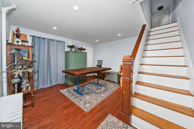 a living room with furniture and a rug