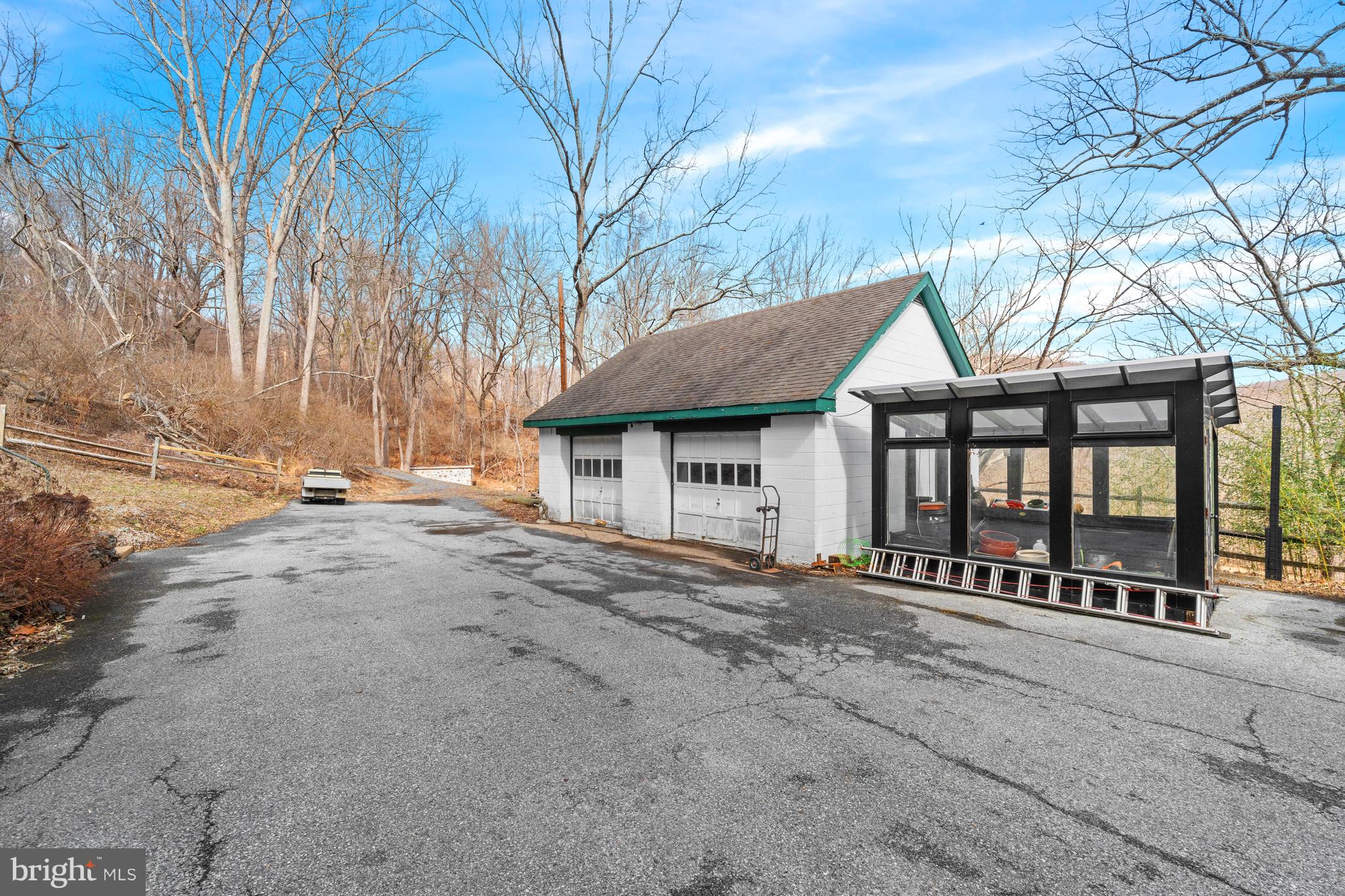 3934 Thompsons Bridge Road Wilmington, DE 19807 - Photo 21 of 28 a view of a house with a yard covered with snow in the background