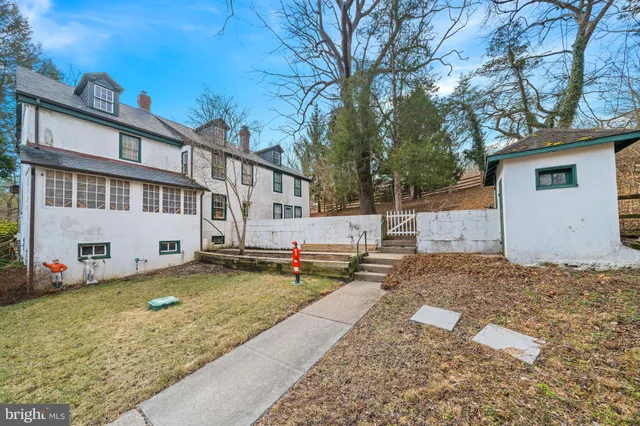 a view of a brick house with many windows