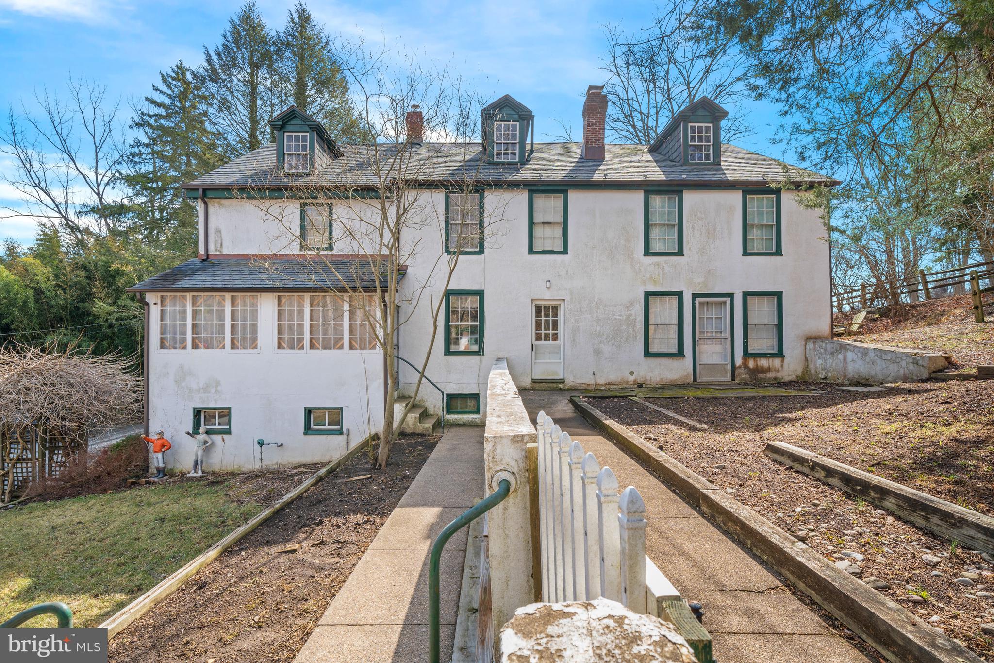 3934 Thompsons Bridge Road Wilmington, DE 19807 - Photo 23 of 28 a view of a brick house with many windows