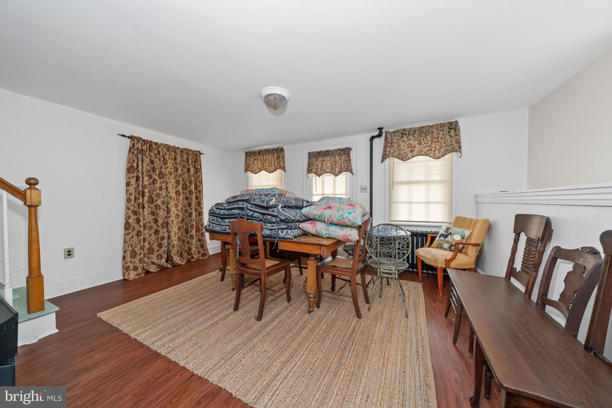 3934 Thompsons Bridge Road Wilmington, DE 19807 - Photo 6 of 28 a dining room with furniture and wooden floor