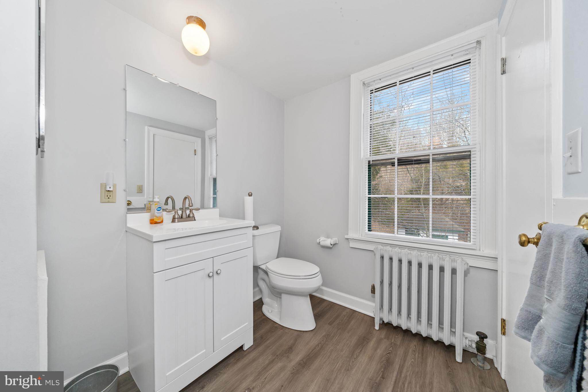 3934 Thompsons Bridge Road Wilmington, DE 19807 - Photo 9 of 28 a bathroom with a toilet sink and a window