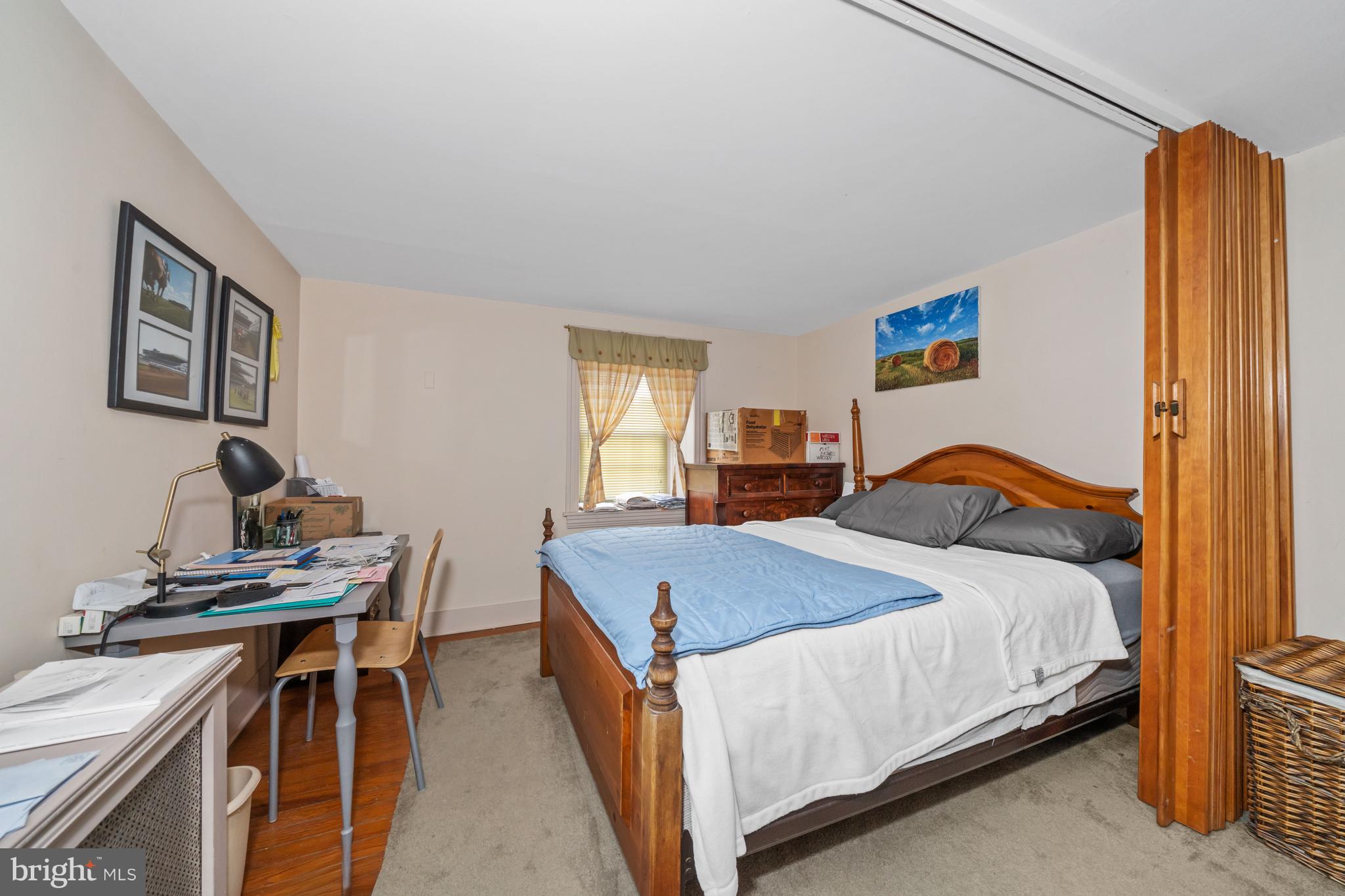 3934 Thompsons Bridge Road Wilmington, DE 19807 - Photo 10 of 28 a bedroom with a bed and a table in it