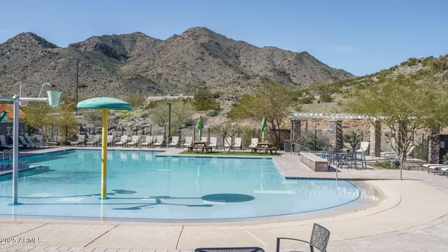 a view of a swimming pool with a yard