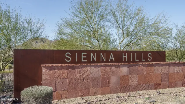 a street sign that is on a wooden wall