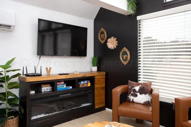 a living room with furniture and a fireplace