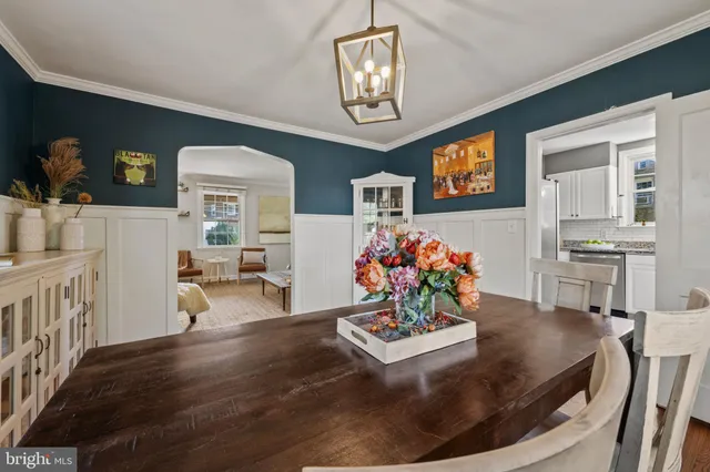a kitchen with stainless steel appliances granite countertop a sink and a stove