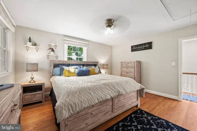 a bedroom with a bed and flat screen tv