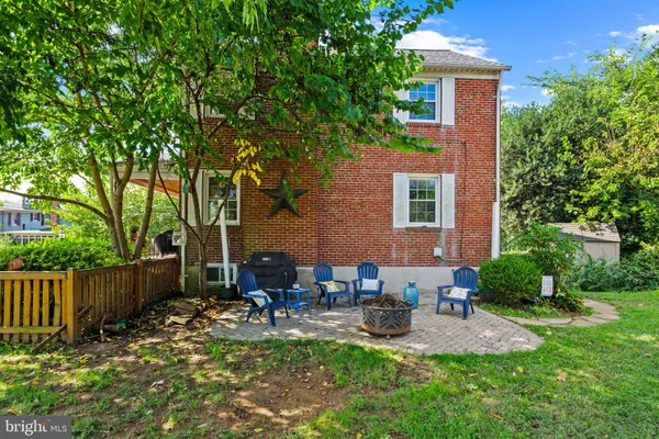 a view of a yard with a tree