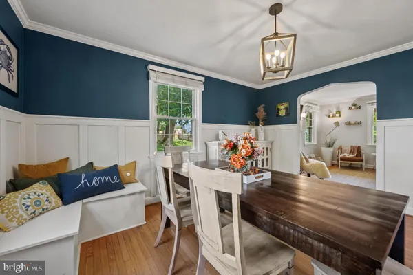 a living room with dining table