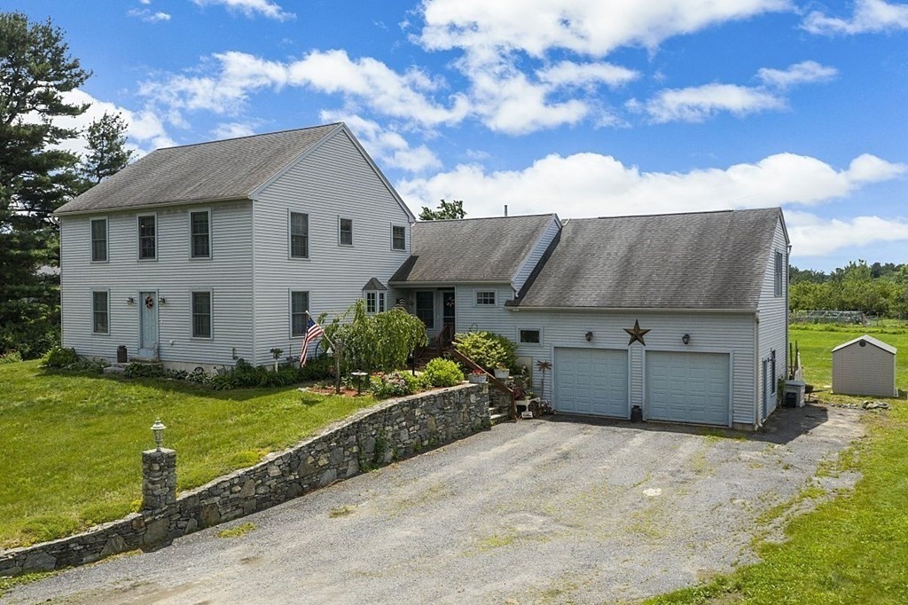 299 South Meadow Road Lancaster, MA 01523 - Photo 1 of 41 a view of a house with backyard and garden