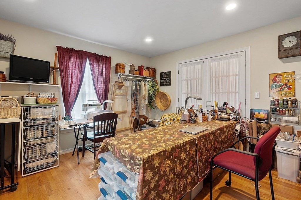 299 South Meadow Road Lancaster, MA 01523 - Photo 11 of 41 a bed room with furniture a flat screen tv and a window