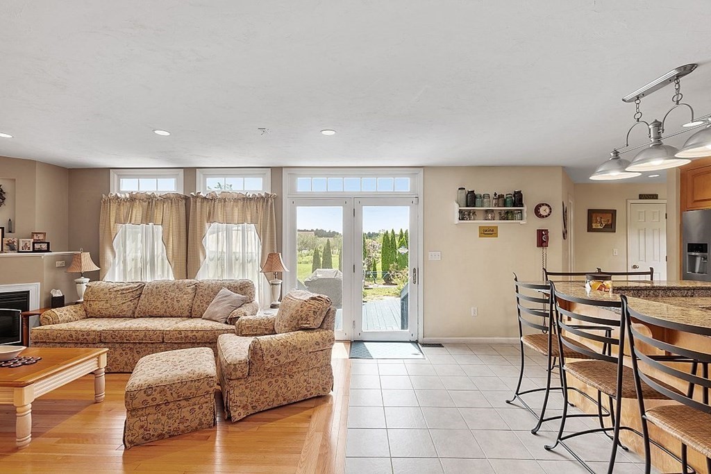 299 South Meadow Road Lancaster, MA 01523 - Photo 12 of 41 a living room with furniture and a large window