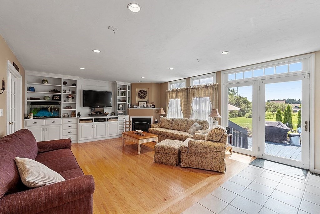 299 South Meadow Road Lancaster, MA 01523 - Photo 13 of 41 a living room with furniture and a flat screen tv