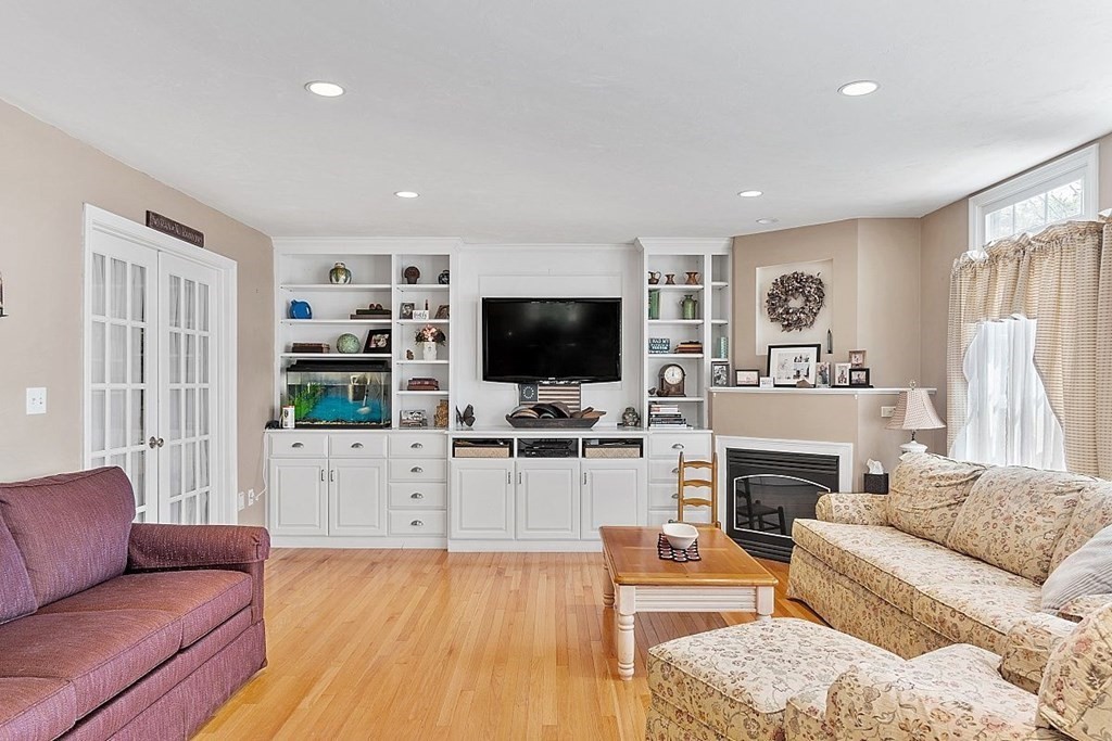 299 South Meadow Road Lancaster, MA 01523 - Photo 14 of 41 a living room with furniture and a flat screen tv