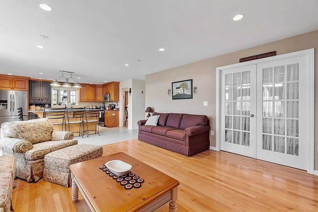 299 South Meadow Road Lancaster, MA 01523 - Photo 15 of 41 a living room with furniture and a view of kitchen