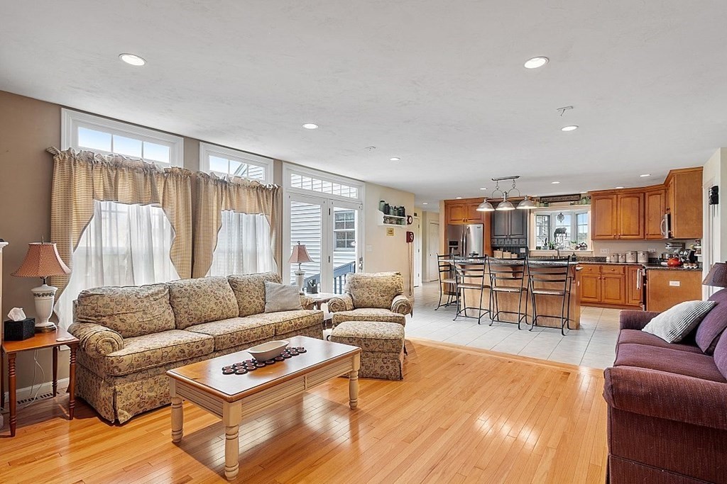 299 South Meadow Road Lancaster, MA 01523 - Photo 16 of 41 a living room with furniture and a large window