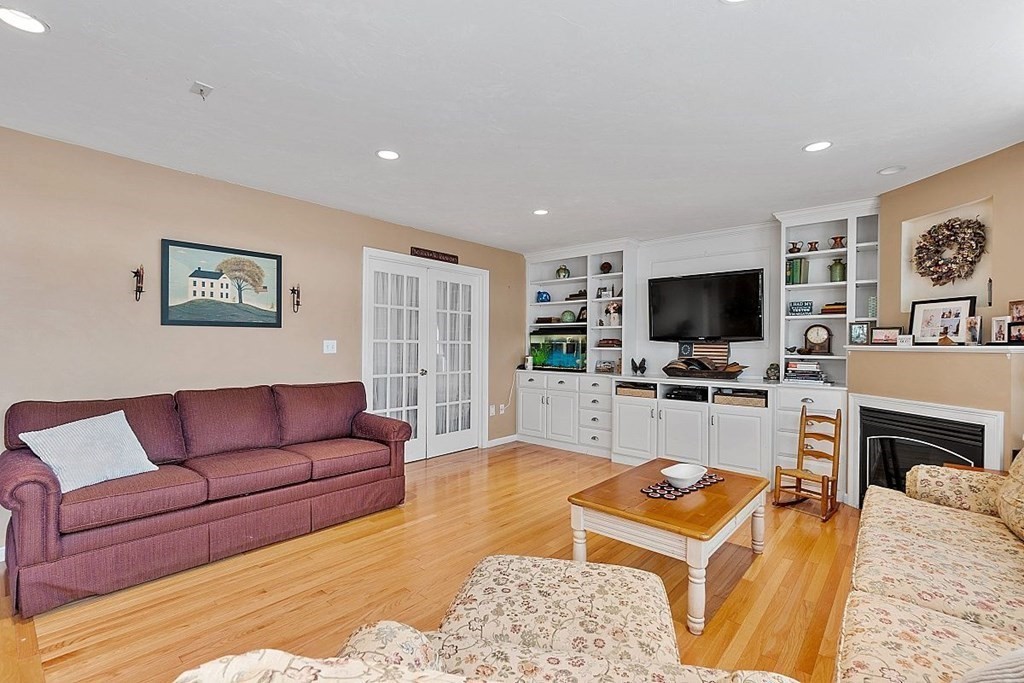 299 South Meadow Road Lancaster, MA 01523 - Photo 17 of 41 a living room with furniture and a flat screen tv