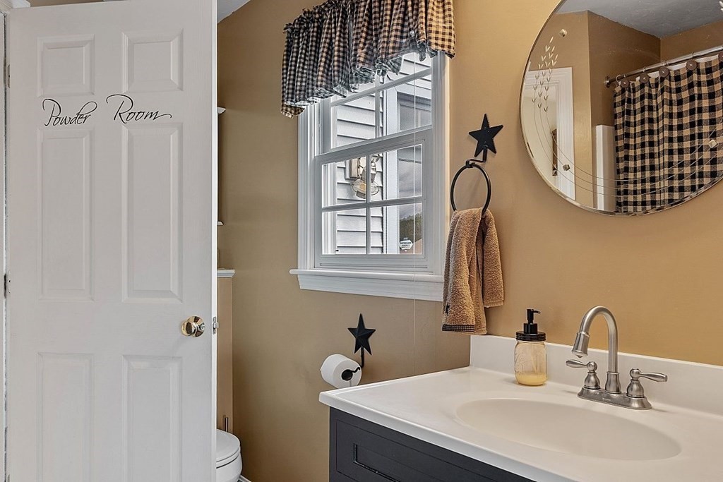 299 South Meadow Road Lancaster, MA 01523 - Photo 23 of 41 a bathroom with a sink and a mirror