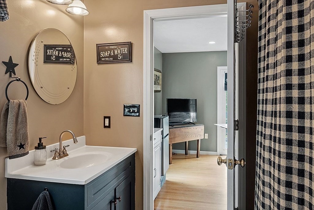 299 South Meadow Road Lancaster, MA 01523 - Photo 24 of 41 a bathroom with a sink and a mirror