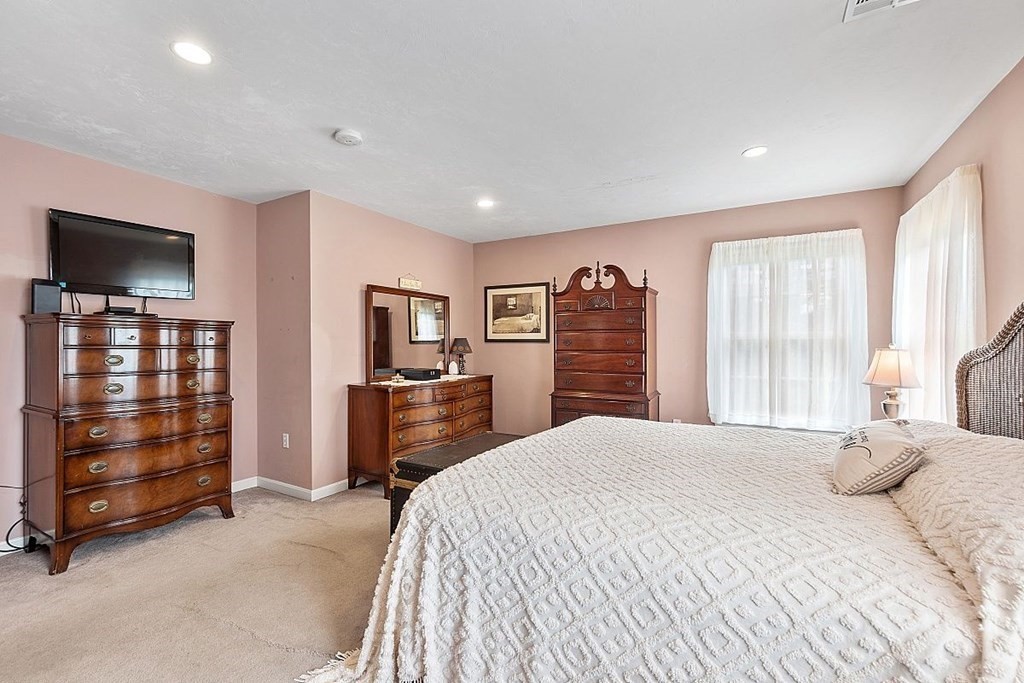 299 South Meadow Road Lancaster, MA 01523 - Photo 30 of 41 a bedroom with a bed and furniture