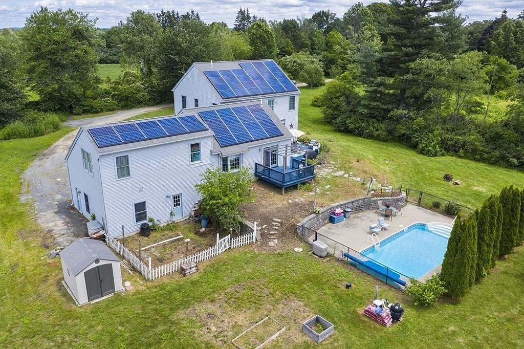 299 South Meadow Road Lancaster, MA 01523 - Photo 3 of 41 an aerial view of a house with garden space and street view