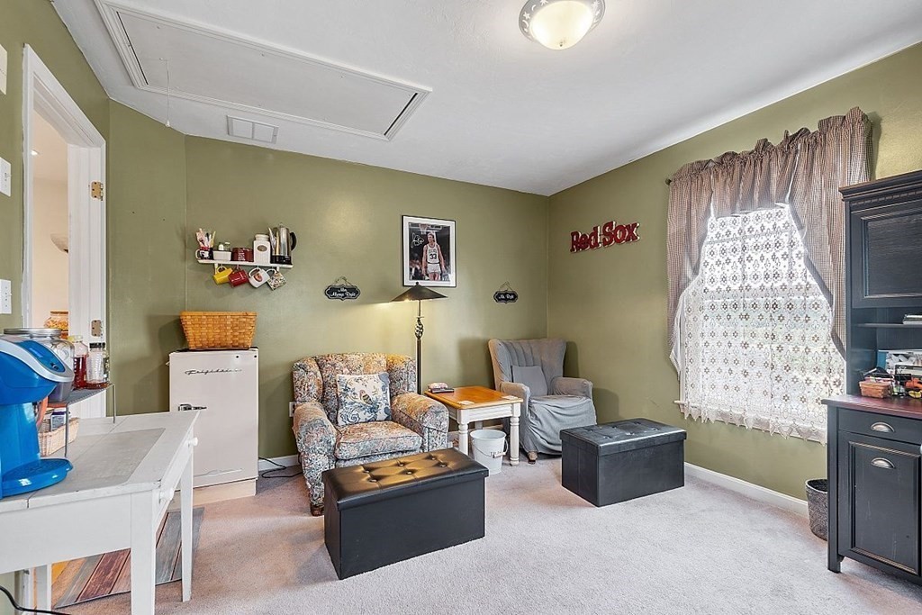 299 South Meadow Road Lancaster, MA 01523 - Photo 35 of 41 a living room with furniture and a window