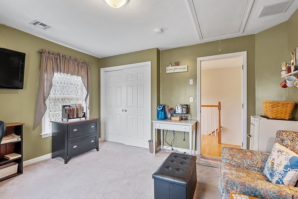 299 South Meadow Road Lancaster, MA 01523 - Photo 36 of 41 a living room with furniture and a window